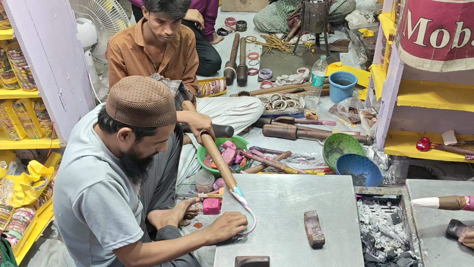 Artisans making lac bangles in a Jaipur workshop