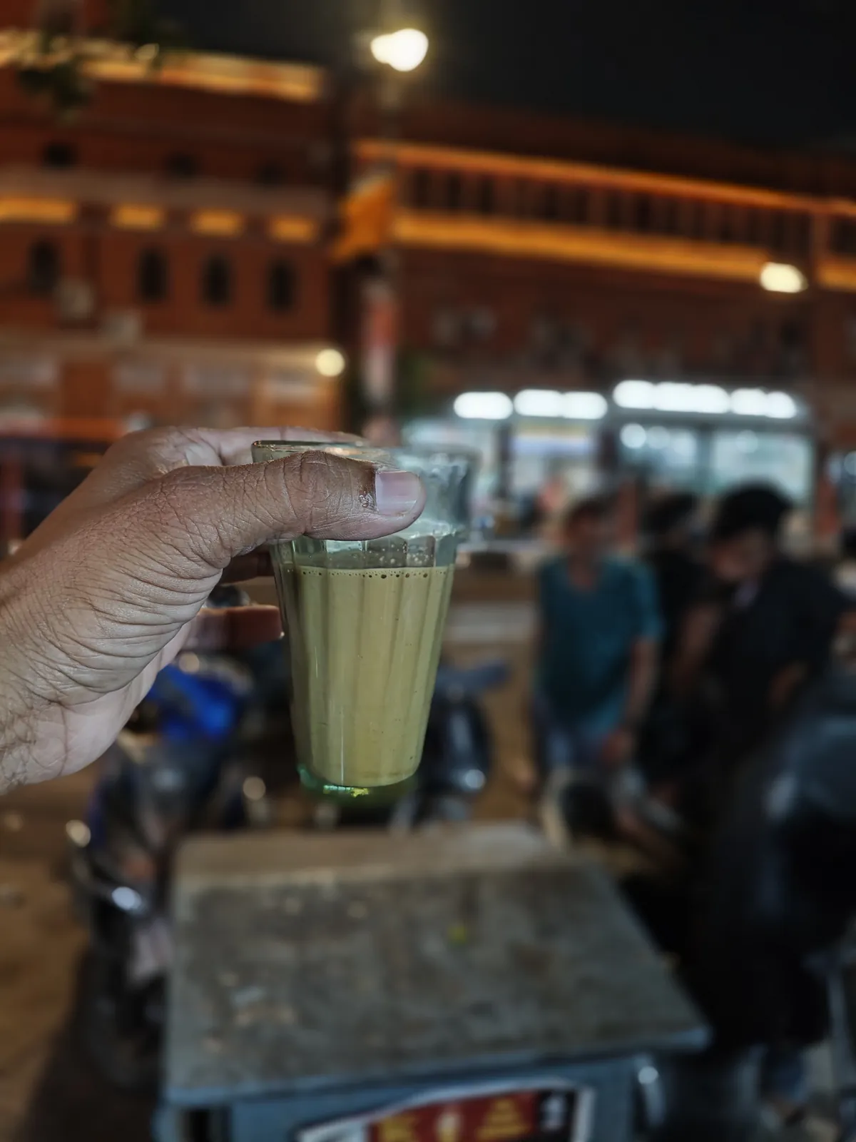 Glass of lassi at a street stall in Jaipur at night
