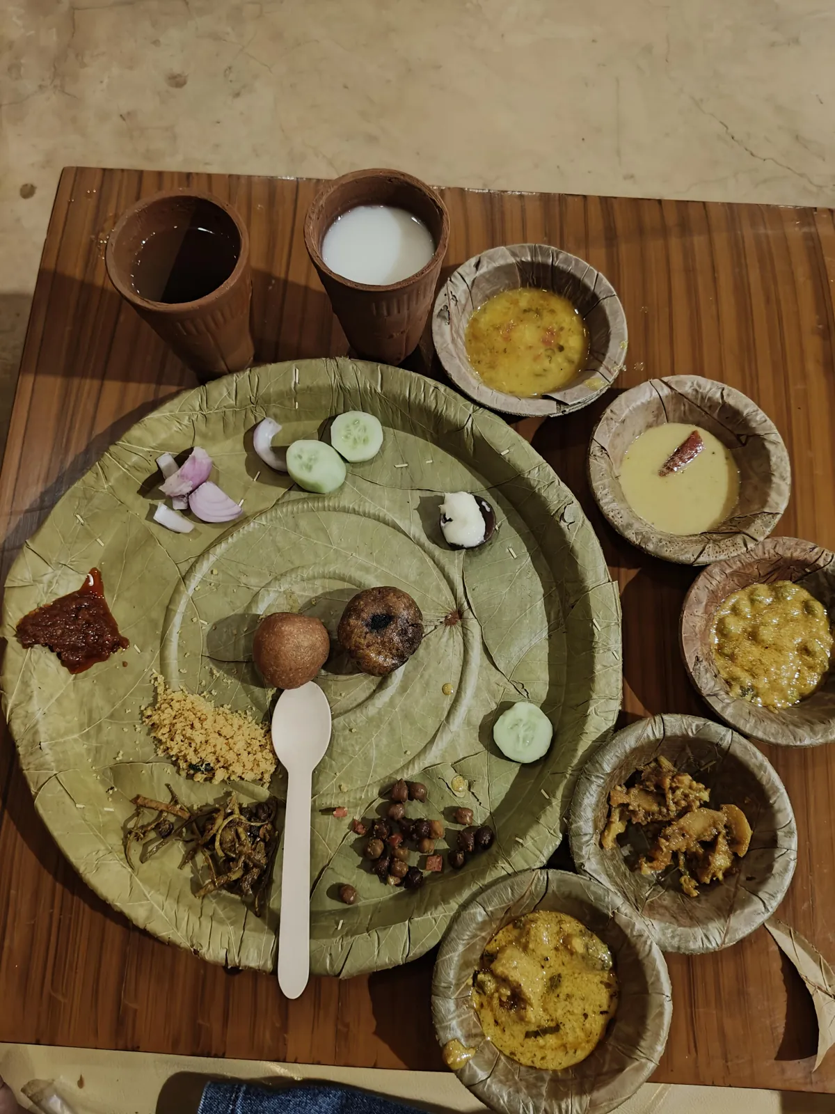 Rajasthani vegetarian thali served on a leaf plate