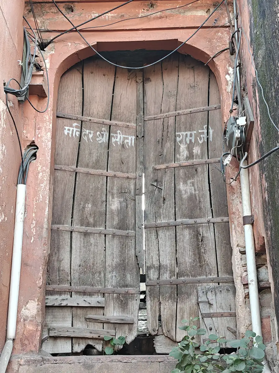 Weathered wooden door of an old house in Jaipur's walled city